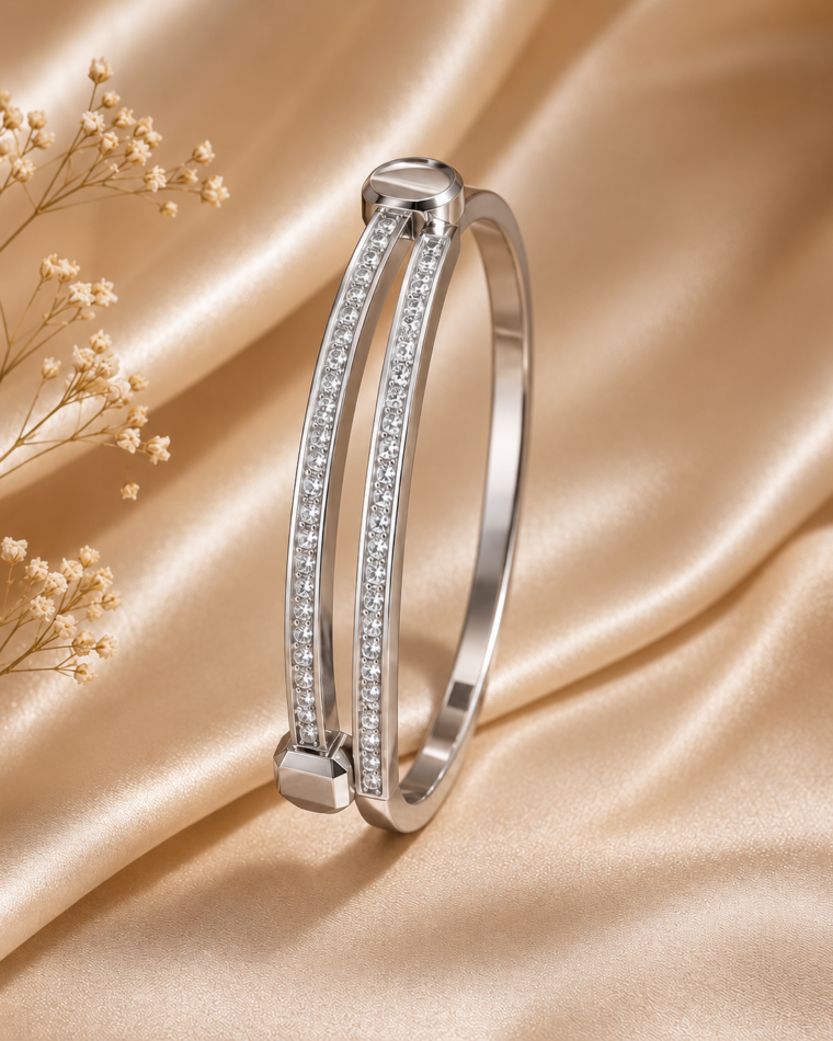 One silver dual-bar zirconia cuff with clear stones on champagne satin