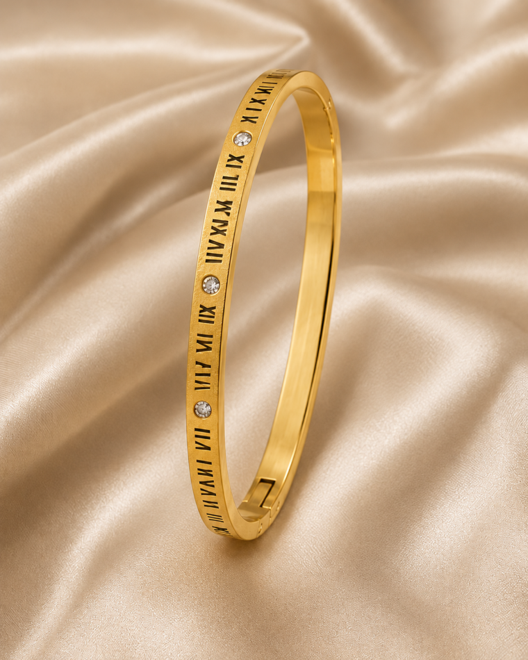 One Monogram Clover Bangle in Gold on champagne satin