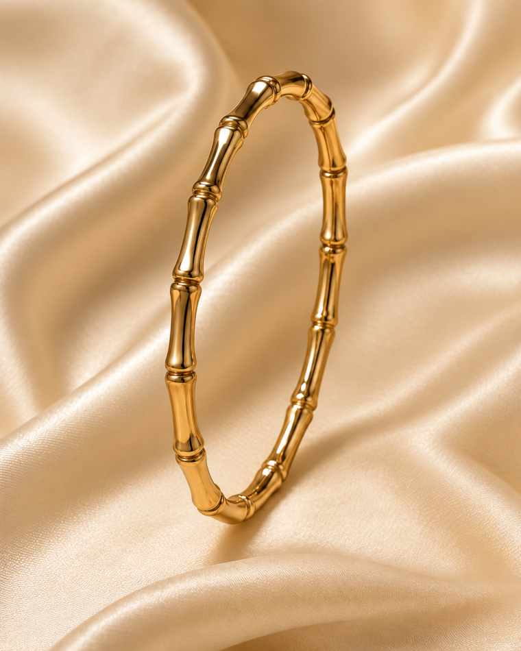 One Roman Numeral Bangle · Gold & Silver in Gold on champagne satin
