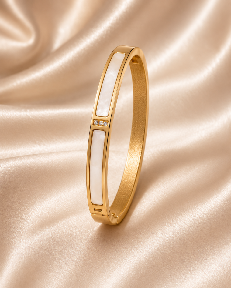 One Shell & Zirconia Bangle in Gold on champagne satin