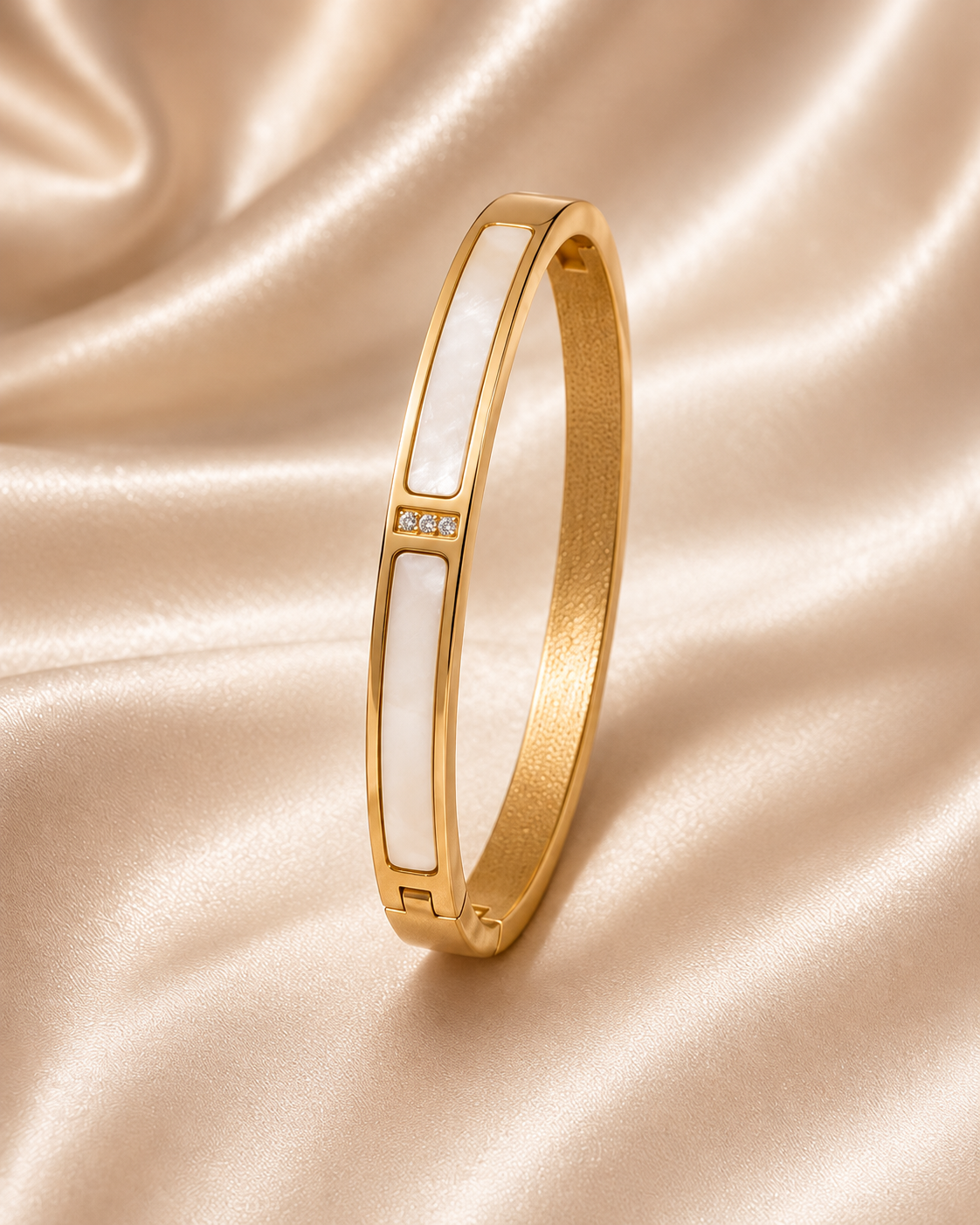 One Shell & Zirconia Bangle in Gold on champagne satin